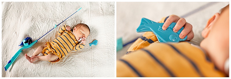 Collage of two images: first, an overhead view of the newborn lying beside a fishing pole, wearing a yellow and blue striped onesie; second, a close-up of the baby's tiny hand clutching the fish from the pole.