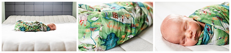 Newborn baby Wallace resting peacefully on his parents’ bed wrapped in a Narnia-inspired swaddle, with close-up details of the blanket and his sleepy newborn features.