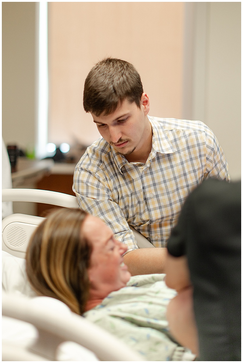Mother receiving support during labor before meeting her baby